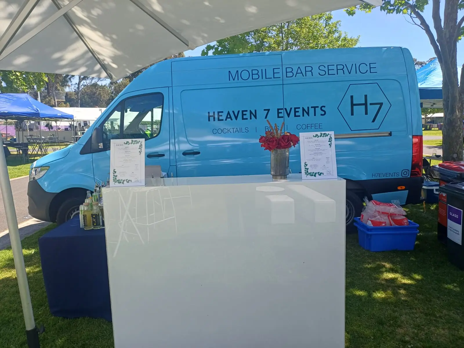 Heaven 7 Events mobile bar van and white bar set up at an outdoor event