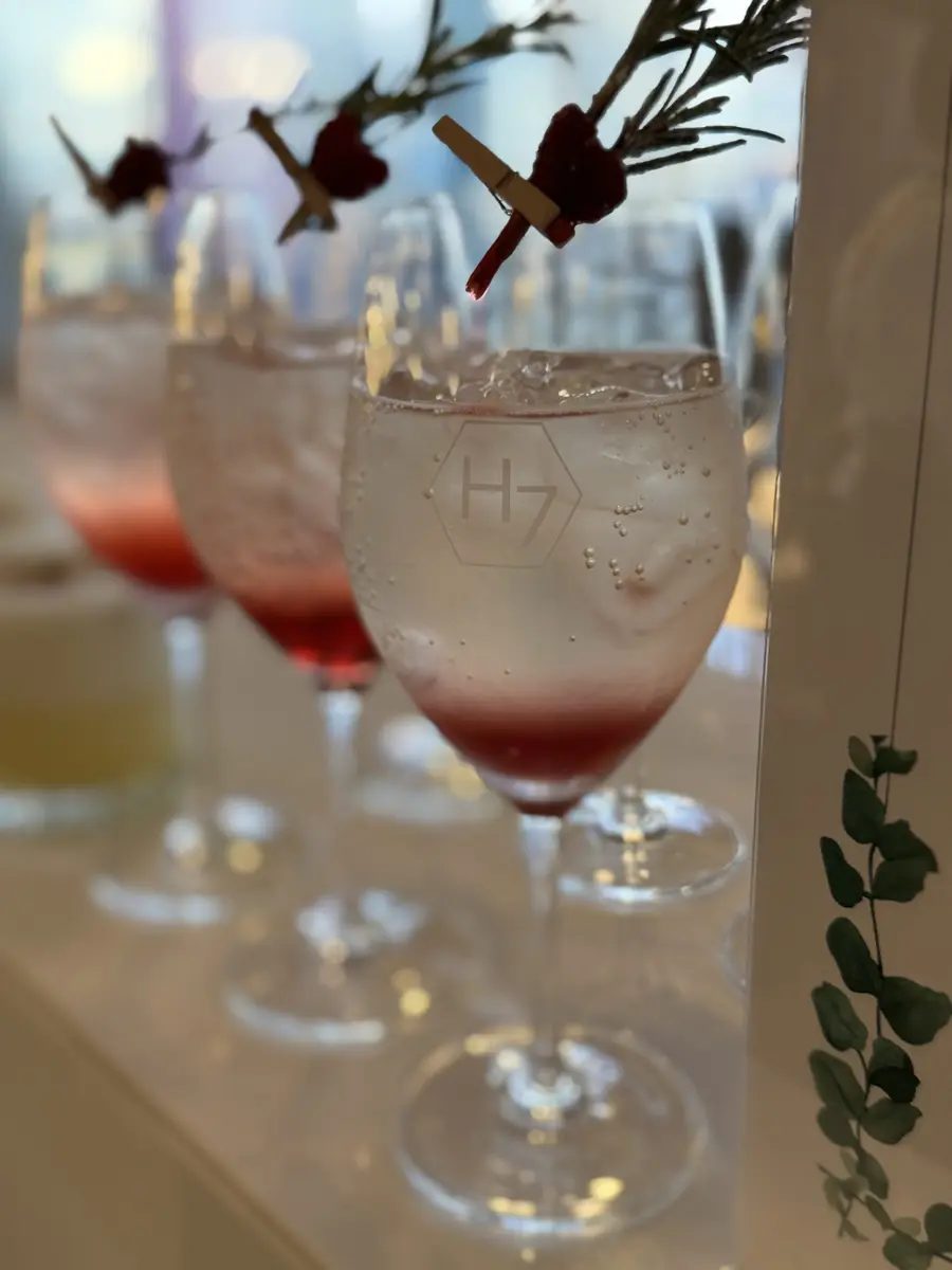 Garnished pink cocktails lined up on a Heaven 7 Events bar
