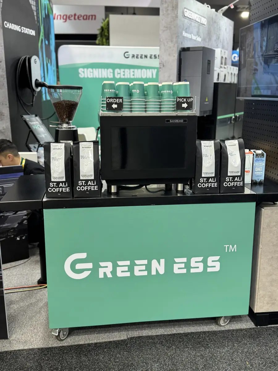 Coffee cart branded for Greeness at an expo signing ceremony