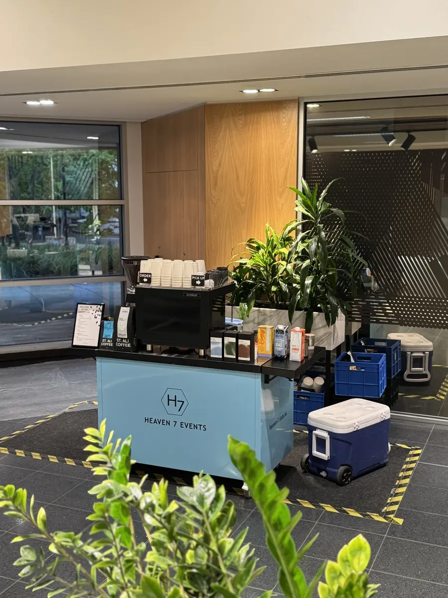 Heaven 7 Events coffee cart set up in a modern office foyer