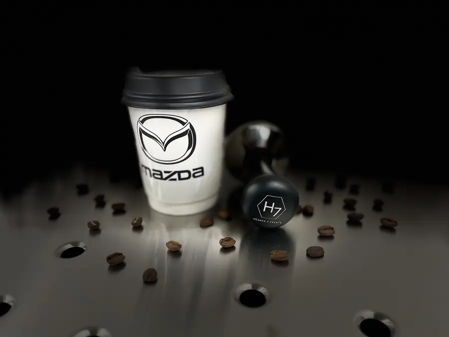Mazda-branded coffee cup with coffee beans for a brand activation