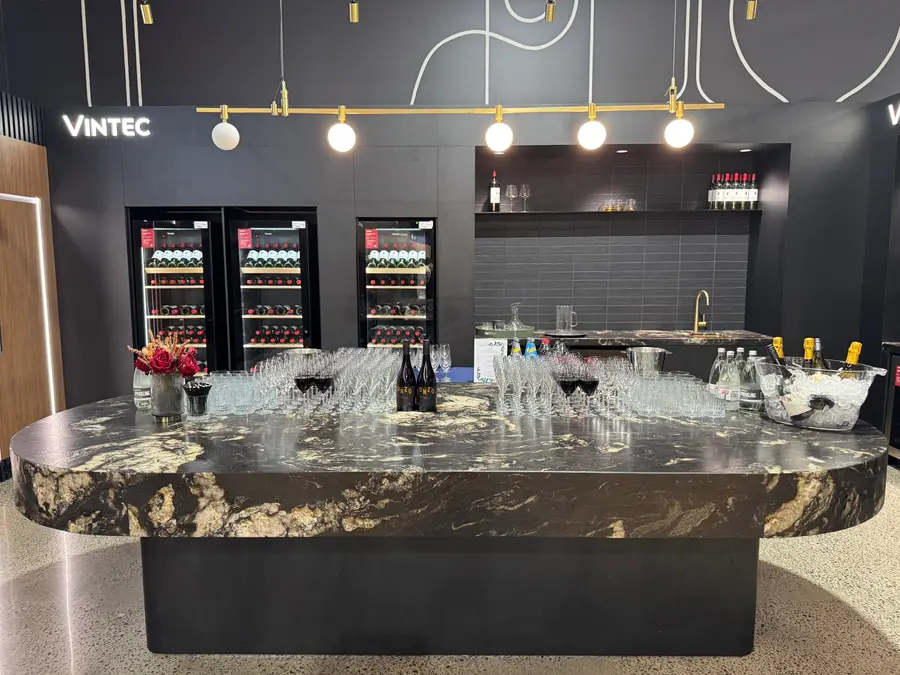 Glassware set out on a marble bar at a Vintec showroom event