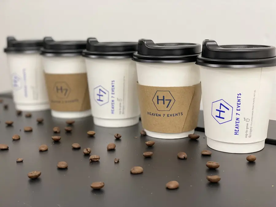 Heaven 7 Events branded coffee cups with coffee beans