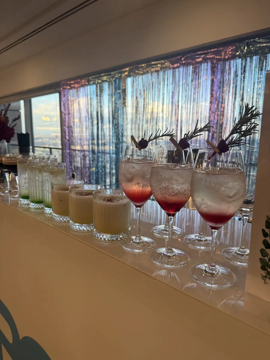 Row of colourful cocktails on a bar at a corporate event