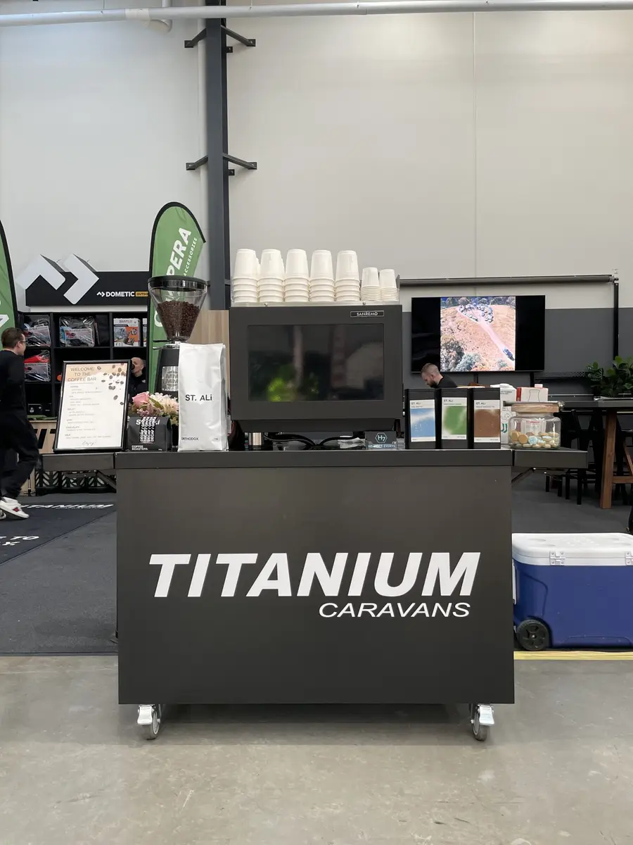 Titanium Caravans branded coffee cart with barista station