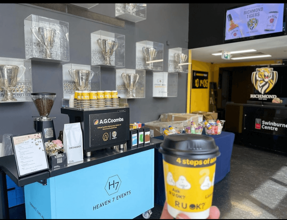 Heaven 7 coffee cart serving R U OK? Day branded coffees at the Richmond Football Club