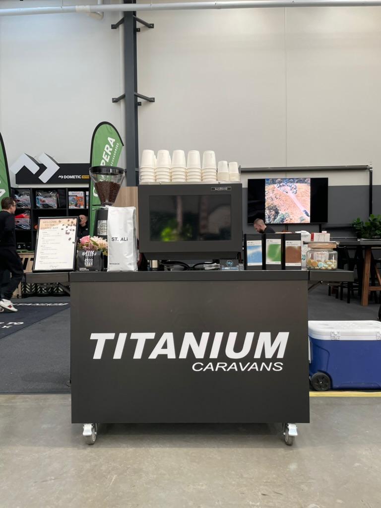 Heaven 7 coffee cart branded for Titanium Caravans at a showroom event